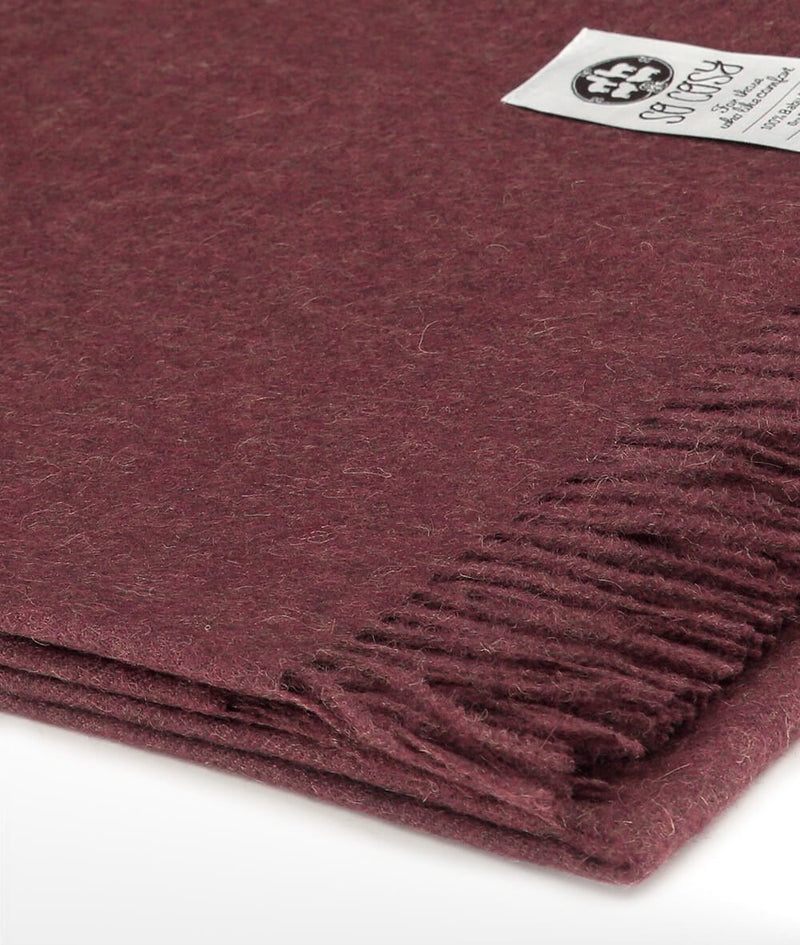 Close up Woven Burgundy Baby Alpaca soft blanket designed in the UK by So Cosy
