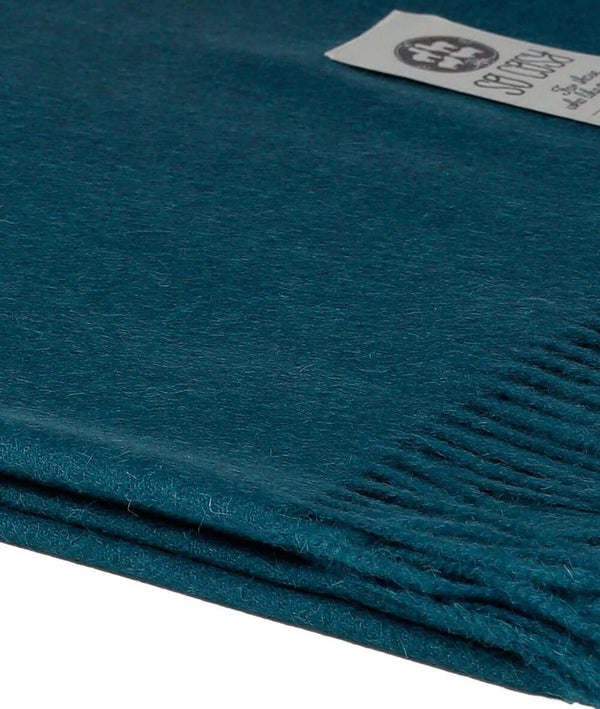 Close up Woven Deep Blue  Baby Alpaca soft blanket designed in the UK by So Cosy