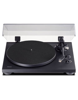 Black turntable with engraved logo TEAC on the left hand side, metallic finishes and transparent box