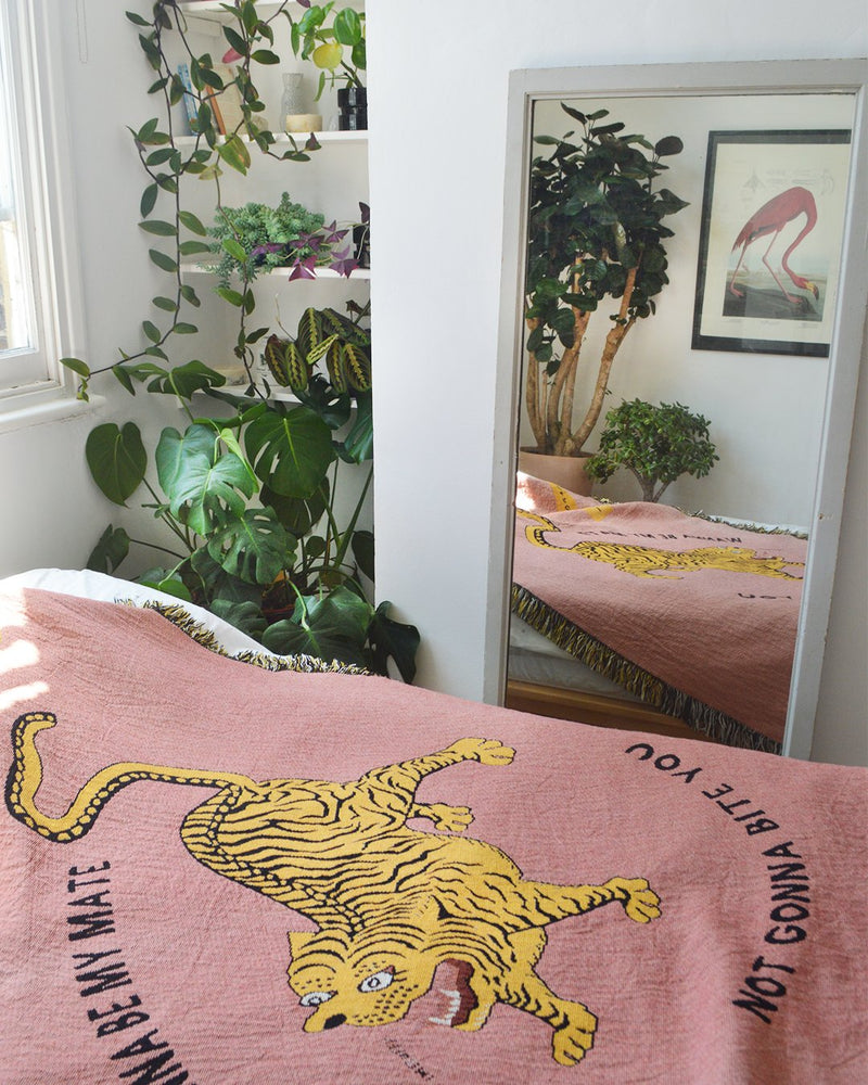 Bedroom picture of jacquard woven tiger cotton throw by East London Digital Illustration Studio Goodbond in collaboration with Cuemars