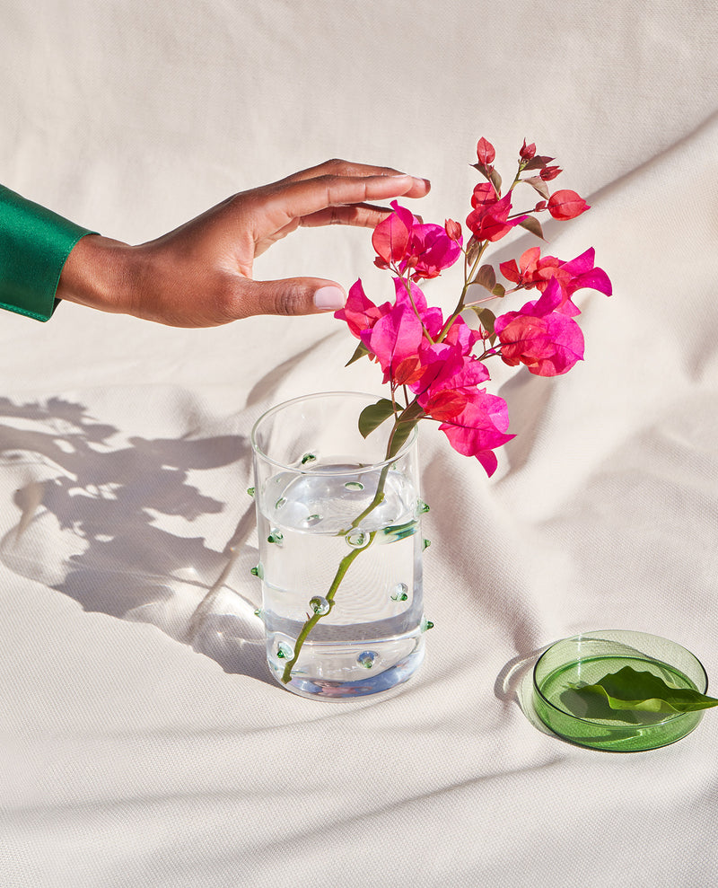 Handmade cylindrical glass vase with flowers by design studio Octaevo inspired by the agave plant
