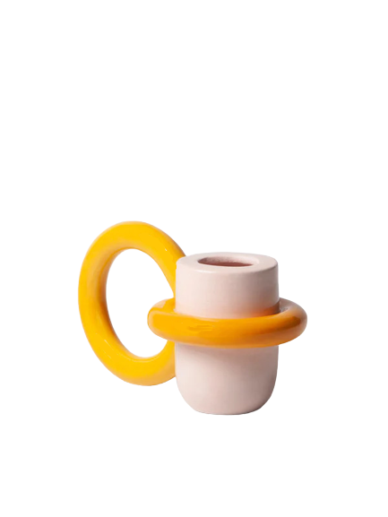 pink and yellow candle holder with a big ring as a holder, by ceramicist Ariana de Luca. Available at www.cuemars.com