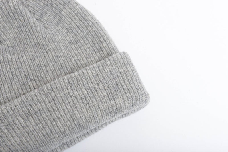 Close up of one sized natural merino wool beanie in light grey
