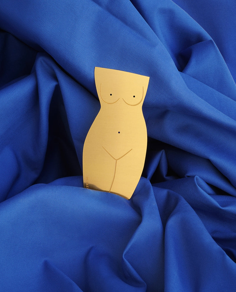 Close up Picture of a finely-cut metal gold Venus body bookmark by Octaevo available at cuemars.com