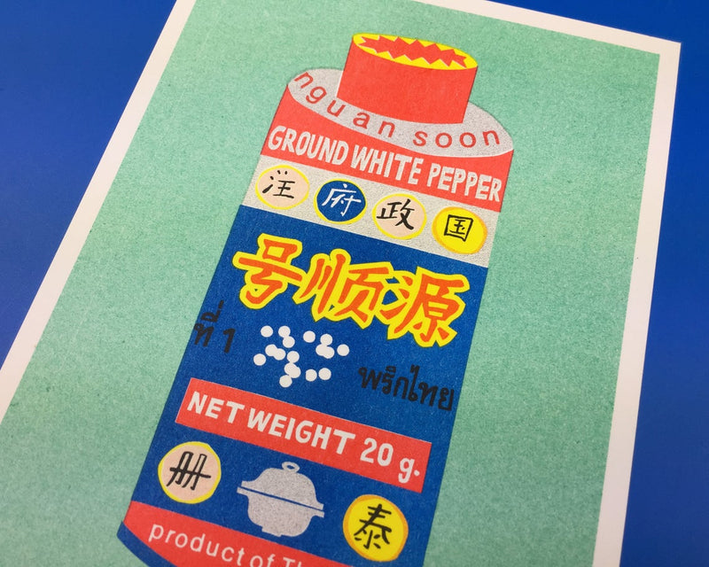 Details of vibrant risograph print featuring a can of Thai ground white pepper on a bright green background. Designed and printed by Dutch studio We Are Out of Office