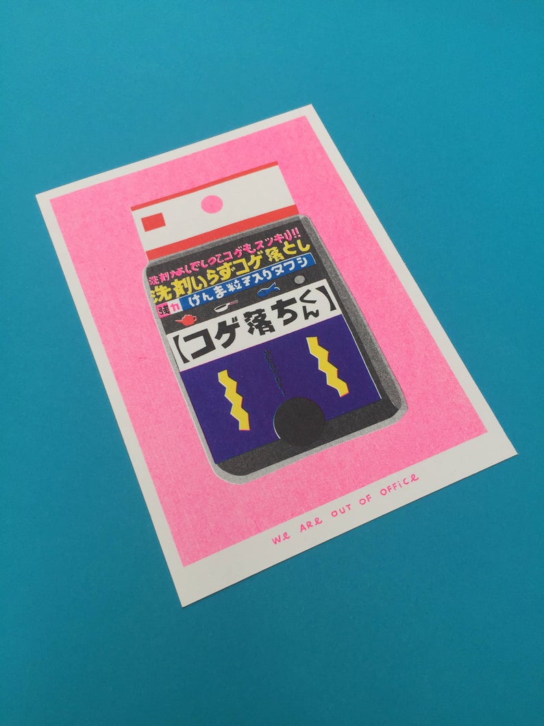 Close up of vibrant print of a Japanese sponge on a bright pink background. Colourful Japanese writing. Designed and printed by Dutch studio We are out of office.