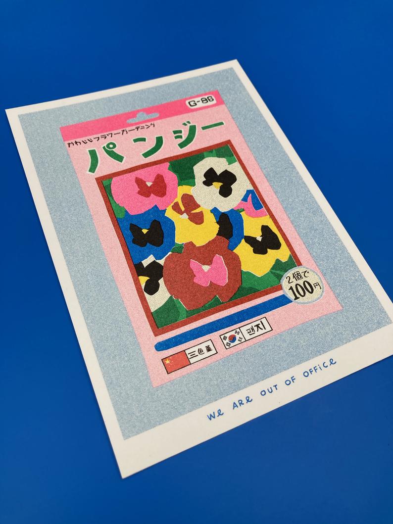 Close up Picture of a Japanese inspired risograph print featuring a package of pansy seeds by Utrecht based We are out of office available now at Cuemars