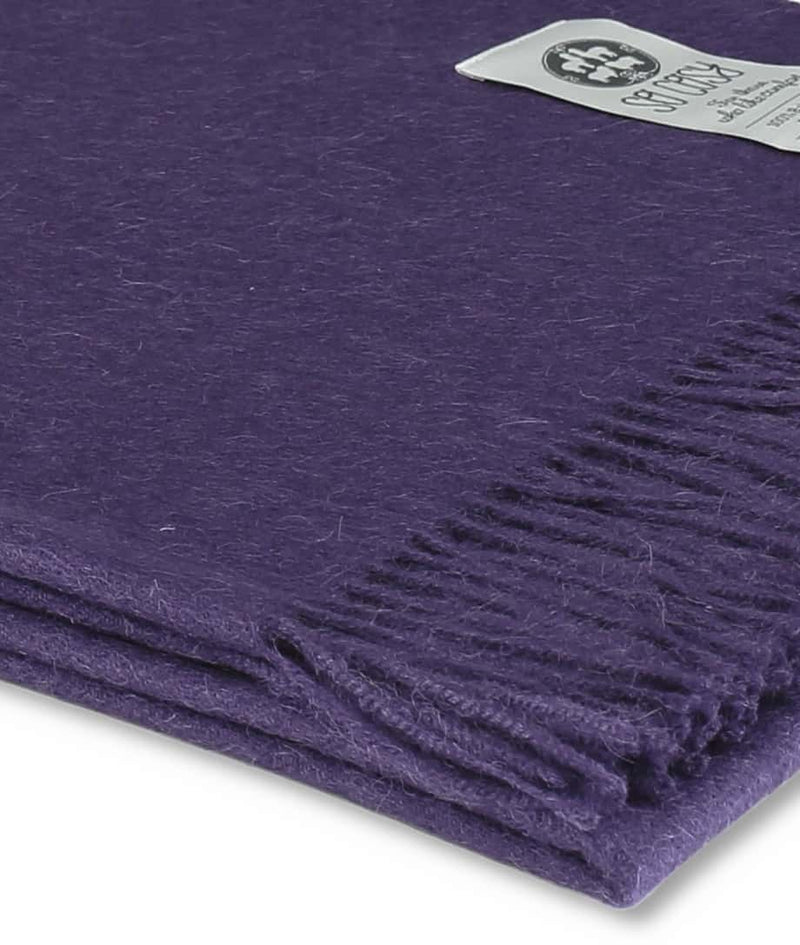 close up picture of handmade super soft baby alpaca throw by so cosy in violet available online and at the store