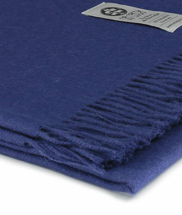 close up picture of handmade super soft baby alpaca throw by so cosy in ribbon blue available online and at the store