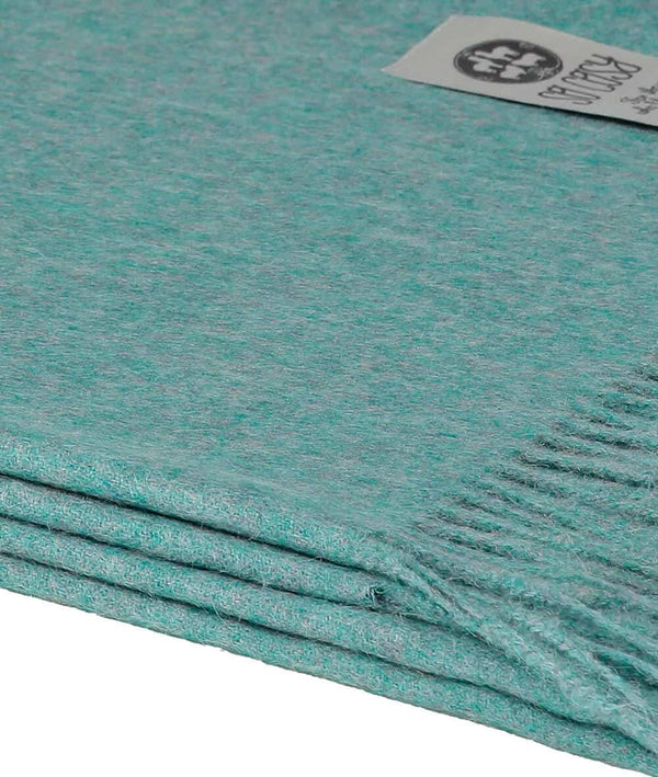 close up picture of handmade super soft baby alpaca throw by so cosy in pastel blue melange available online and at the store