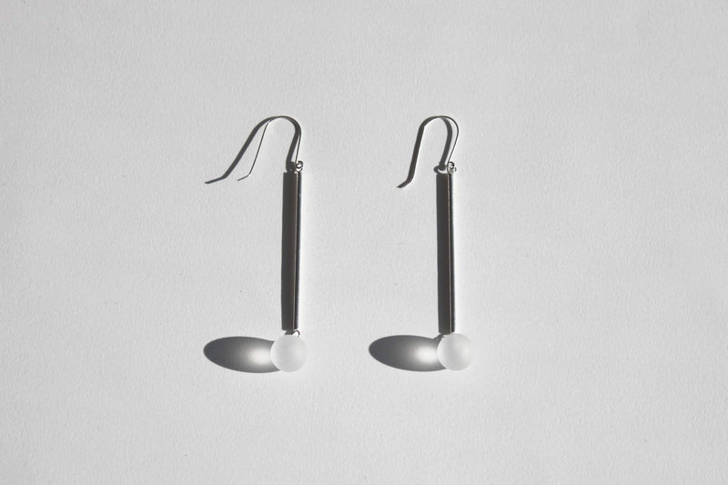 Details of handmade pendant earrings in sterling silver and rock crystals