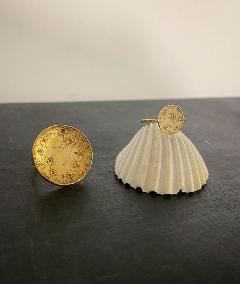Moon ring in gold vermeil featuring a full moon and the moon craters that have been made by hand individually by Momocreatura in London