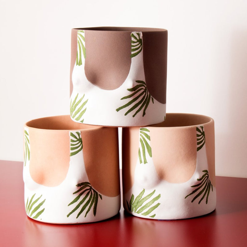 Close up details of Tropical leaves top handmade ceramic plant pot designed by Group Partner