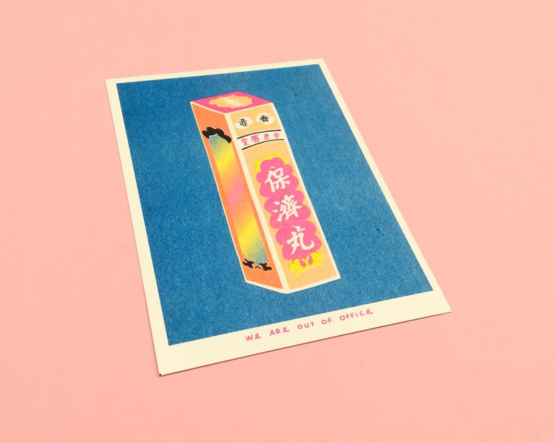Details of vibrant risograph print of a pink and orangy  box of Chinese Po Chaii pills on a deep blue background. Designed and printed by Dutch company We are out of office.
