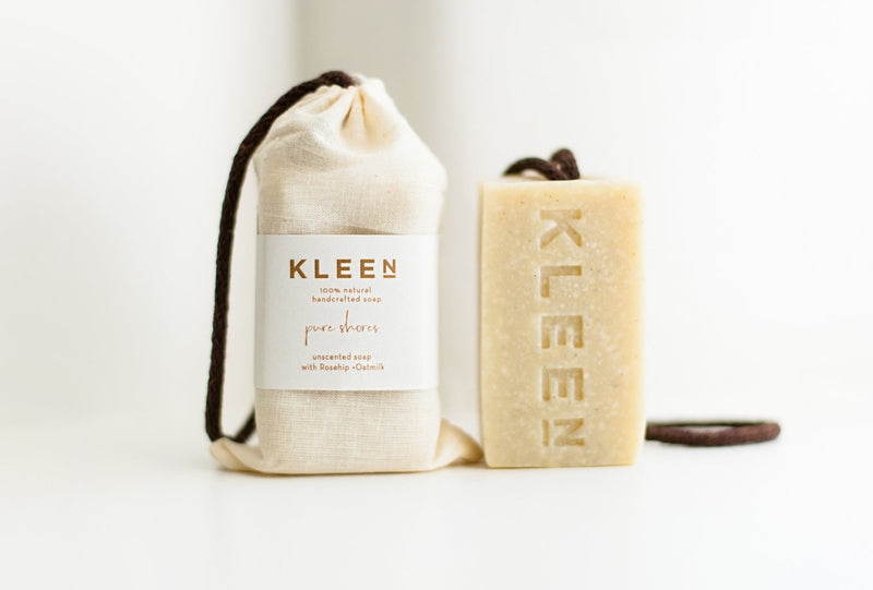 Unscented soap on a cotton rope by natural skincare brand Kleen soaps for sensitive skins and a cotton travel bag
