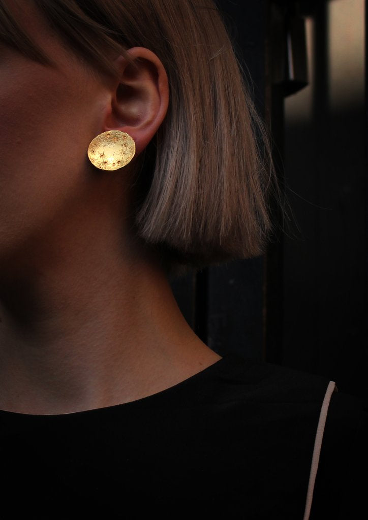 Lifestyle picture of 22ct gold plated Silver Full Moon earrings by Momocreatura