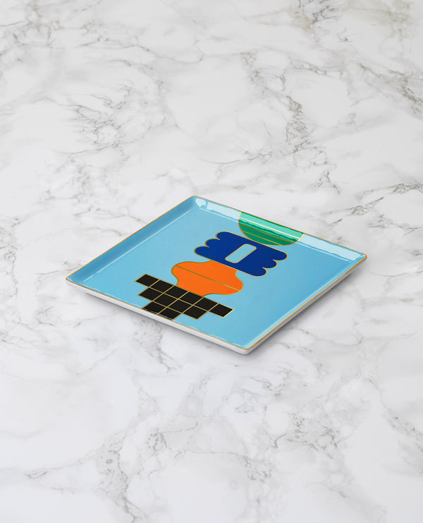 Lifestyle picture of a handmade ceramic tray designed by Octaevo available now at Cuemars