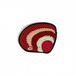 Hand embroidered brooch of a clam by French company Macon et Lesquoy, available to purchase at www.cuemars.com