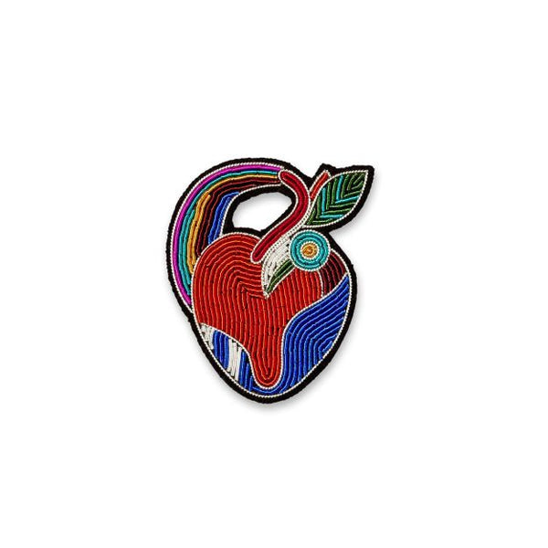 Heart hand embroidered in very bright red, blue, green, pink and ochres designed by French company Macon et Lesquoy. Available at www.cuemars.com