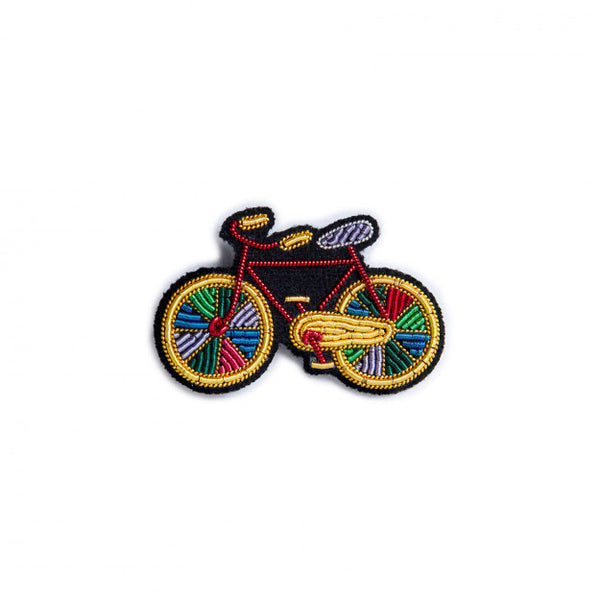 Colourful bike embroidered in yellow, red, blue and green by Macon et Lesquoy. Handmade brooch available at www.cuemars.com