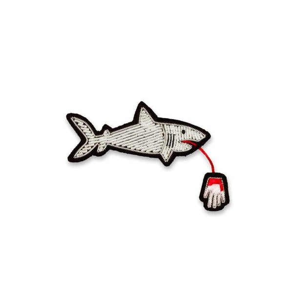 Hand embroidered brooch of a shark by French company Macon et Lesquoy, available to purchase at www.cuemars.com