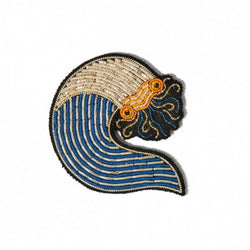 Hand embroidered brooch of a wave by French company Macon et Lesquoy, available to purchase at www.cuemars.com