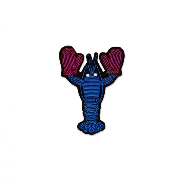 Hand embroidered brooch of a blue lobster by French company Macon et Lesquoy, available to purchase at www.cuemars.com