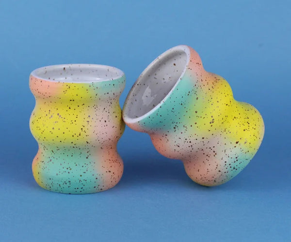 Wavy coffee cups without handles with pastel colour clouds. Designed and handmade by Minx Factory and sold at cuemars.com