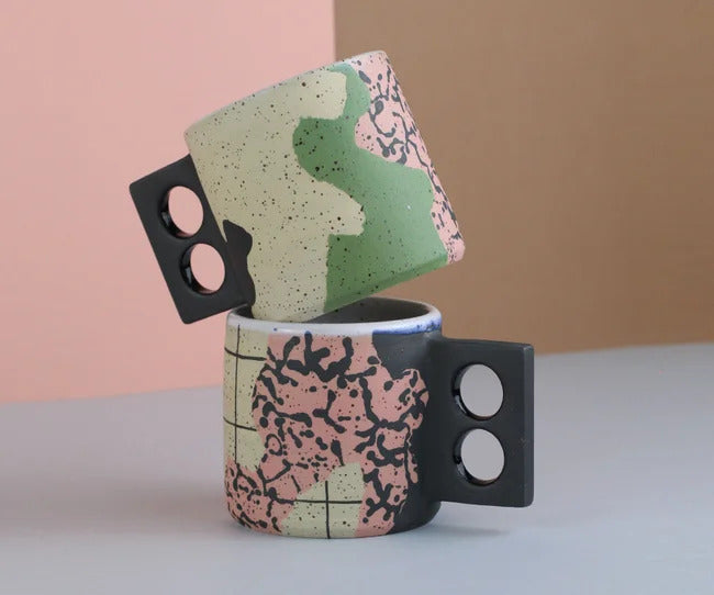 Colourful pattern in pink and green ceramic mug by Minx Factory. Available at cuemars.com