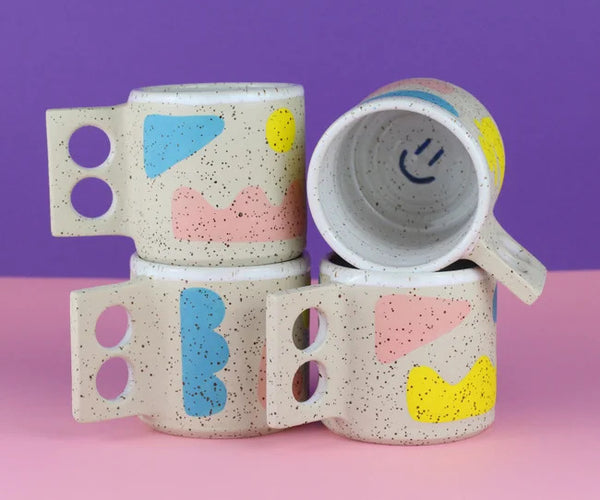 Pink yellow and blue handmade ceramic mug by Minx Factory, available at cuemars.com