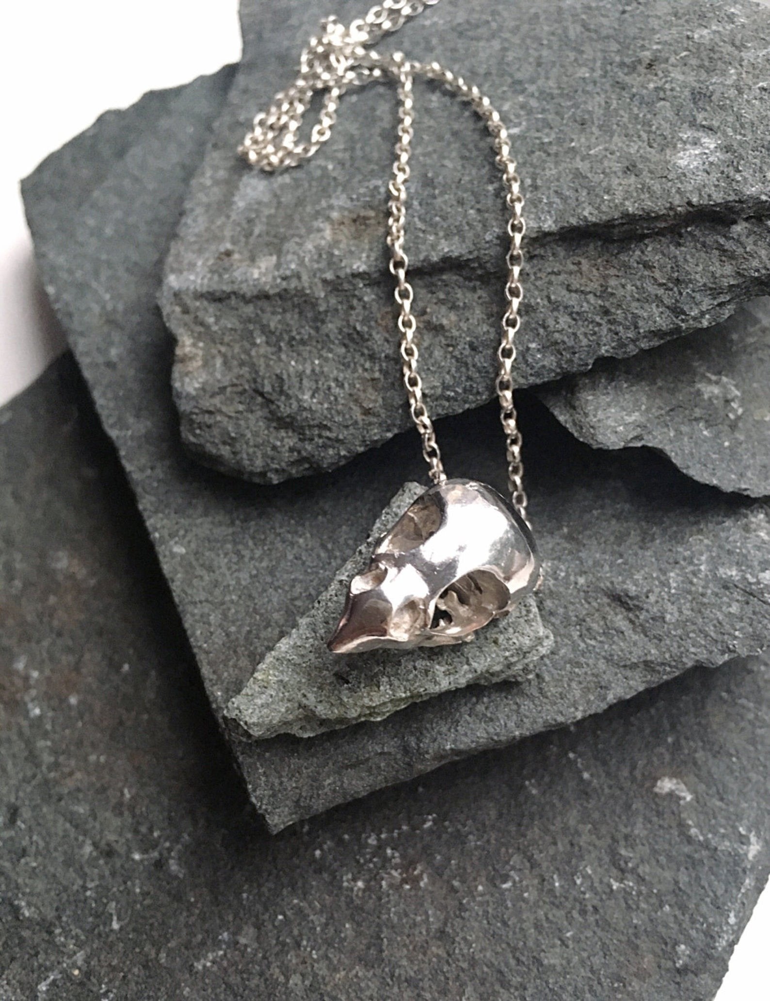 Handmade sterling silver bird of prey skull necklace close up details