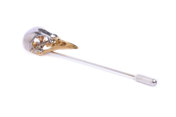 Handmade bird skull lapel pin by Misan Jewellery in Sterling Silver and gold plated beak