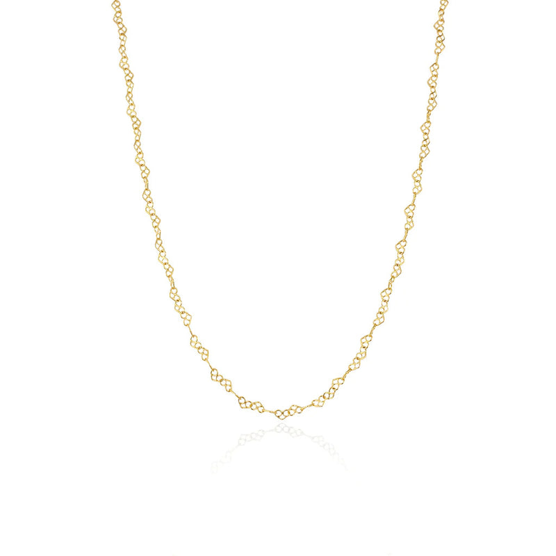 pretzel like hearts linked in a gold plated silver chain, by Momocreatura. Available at www.cuemars.com