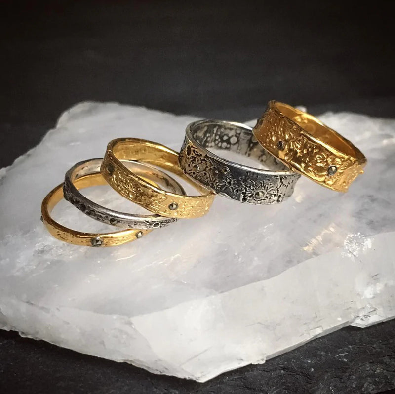 moon crater rings handmade in oxidised silver and gold by London based jewellery designer Momocreatura. Available at www.cuemar.com