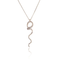 silver snake necklace with intricate skin details made by hand in London by Momocreatura. Avialable at www.cuemars.com