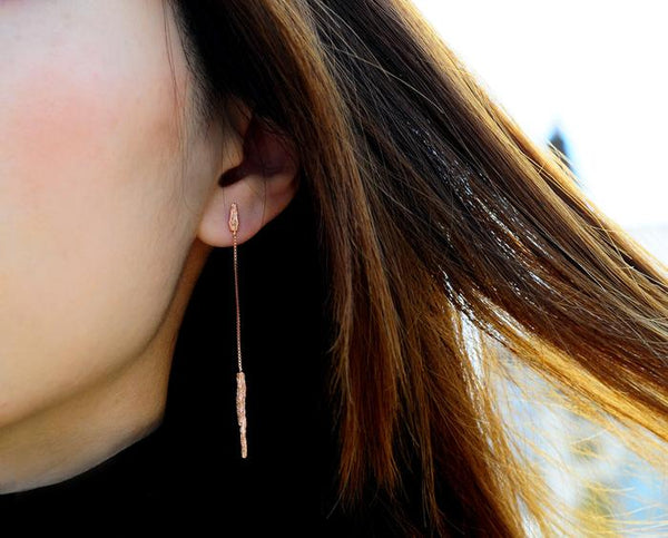 close up details of handcrafted 22ct gold plated silver pendants