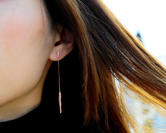 close up details of handcrafted 22ct gold plated silver pendants