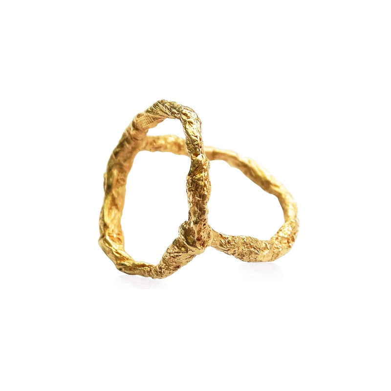 close up of handcrafted raw and unique geometric 22ct gold plated sterling silver
