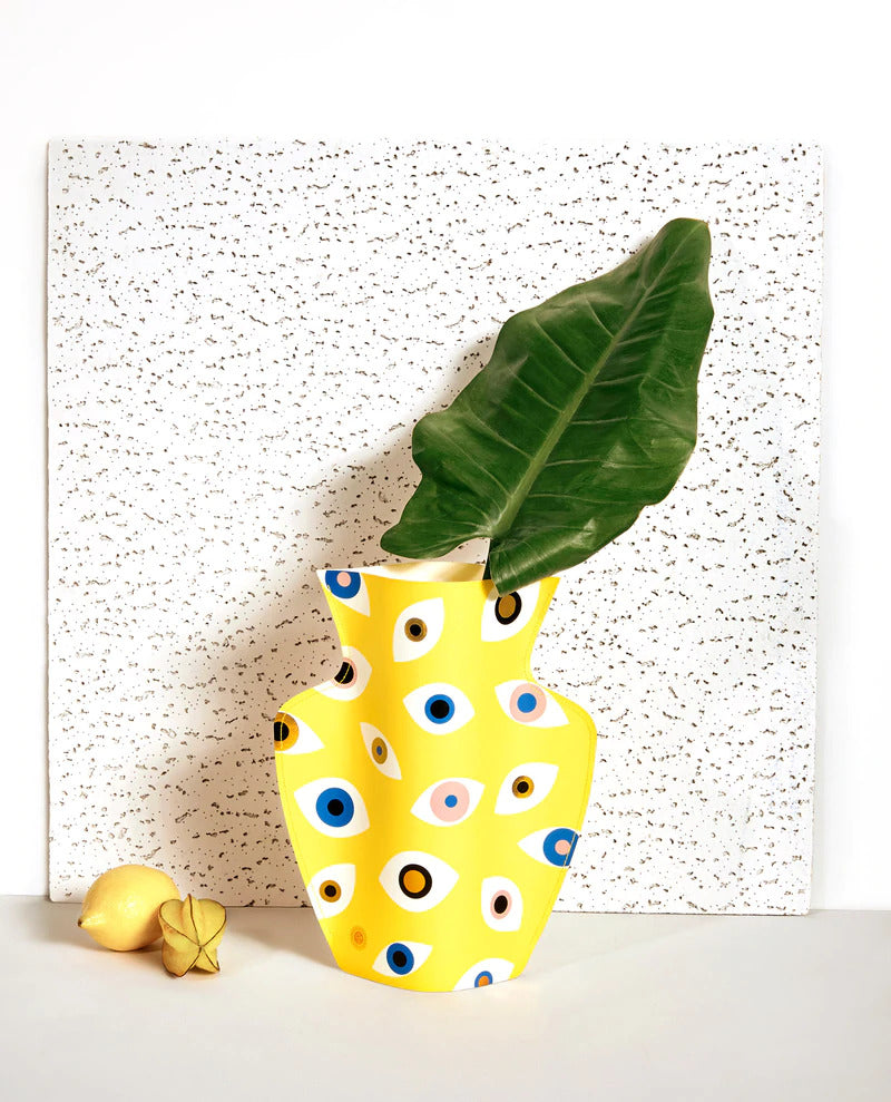 yellow paper vase with illustrations of eyes in different colours by Spanish design studio Octaevo, available at cuemars.com