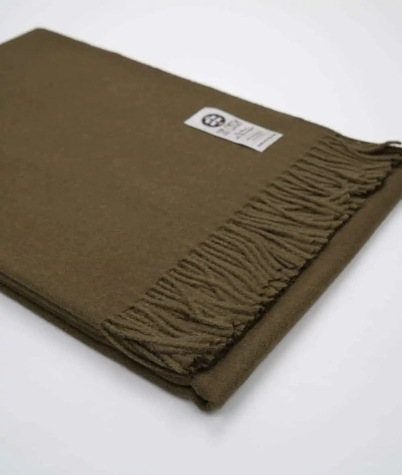 picture of handmade super soft baby alpaca throw by so cosy in olive green available online and at the store