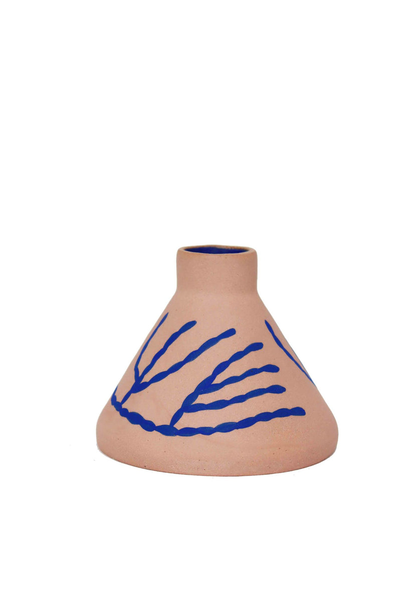 Cone shaped ceramic vase by Hackney based Sophie Alda. Pink vase with hand painted blue illustrations. Available at Cuemars