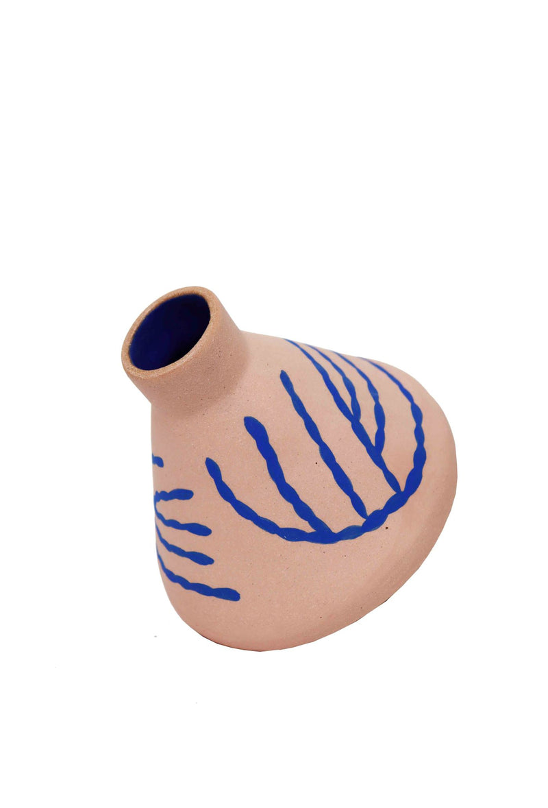 Cone shaped ceramic vase by Hackney based Sophie Alda. Pink vase with hand painted blue illustrations. Available at Cuemars