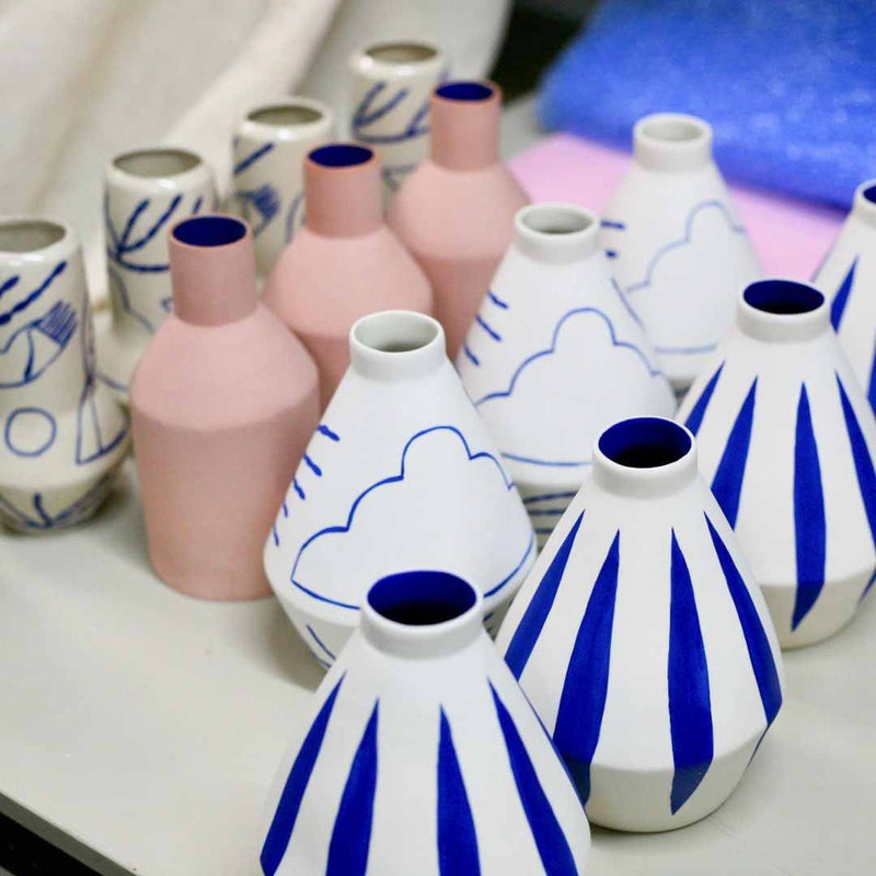 handmade diamond shaped porcelain vase with blue motifs by ceramicist Sophie Alda, available at cuemars.com
