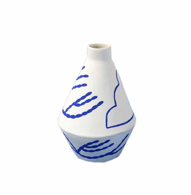 handmade diamond shaped porcelain vase with blue motifs by ceramicist Sophie Alda, available at cuemars.com