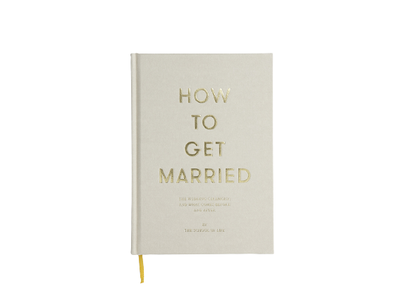 Beige and gold lettered book called How To Get Married by The School of Life. Available at cuemars.com