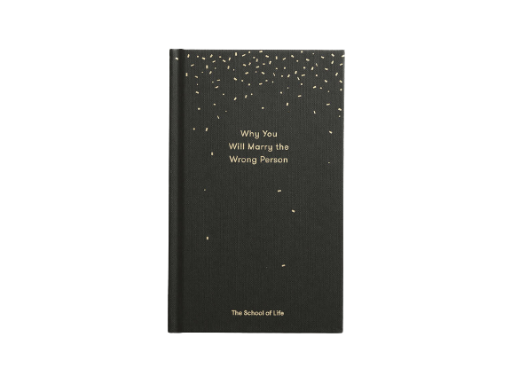 Black and gold book called Why you will marry the wrong person by The school of life. Available at cuemars.com