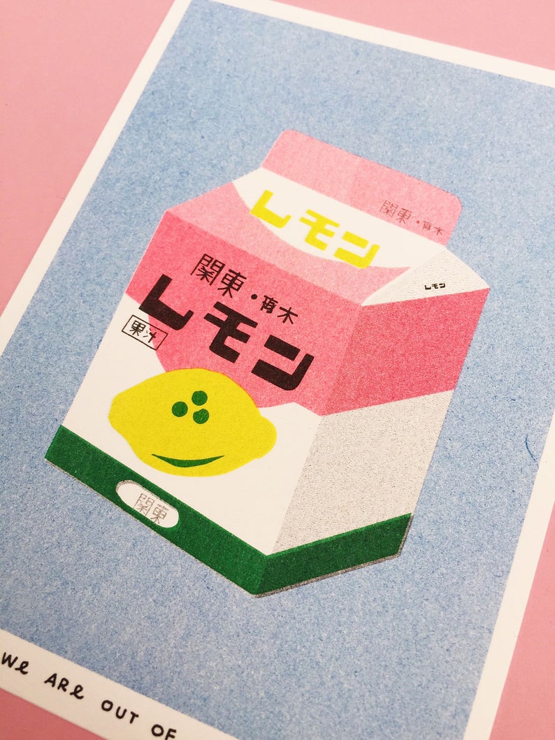 Details of vibrant carton of Japanese lemon milk in a pastel blue background. Designed and printed by Dutch company We Are Out of Office.
