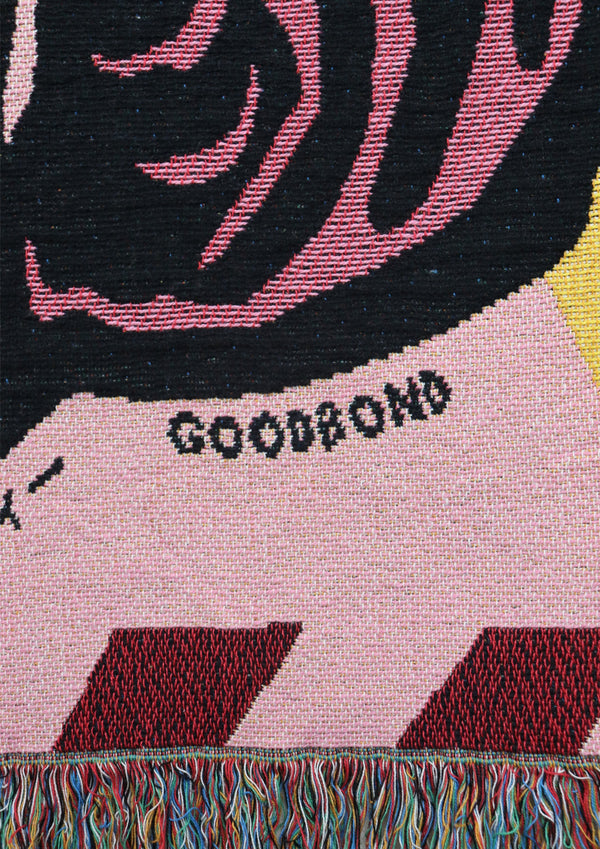 Bright Pink and Black Tibetan tiger throw with the brand Goodbond woven on black letters